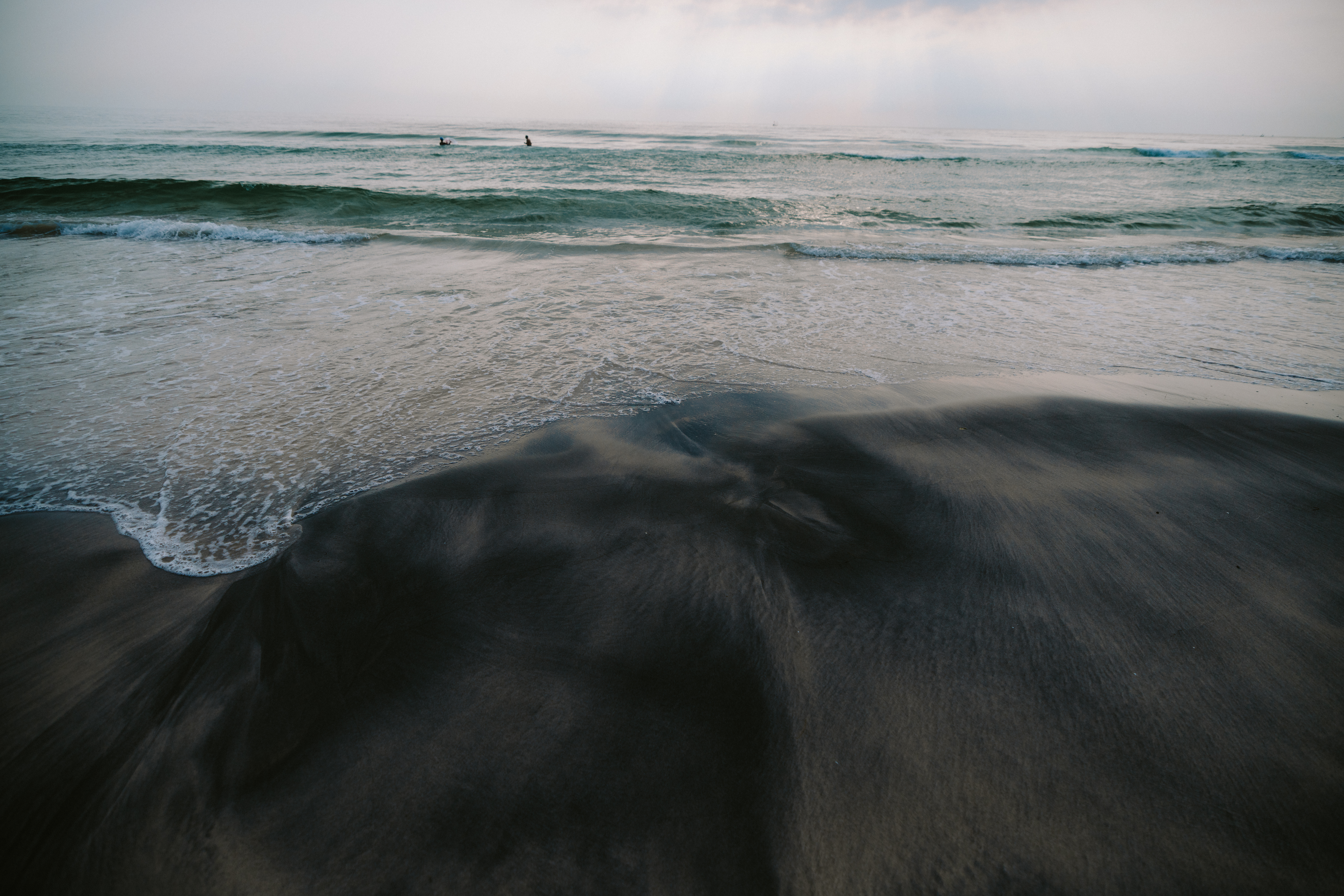 A black-sand beach